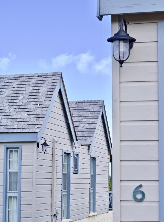 two white buildings next to a house at West Rock Villas in Saint James