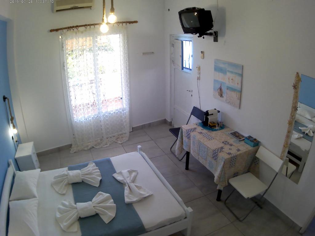 TV a/nebo společenská místnost v ubytování Apanemia Rooms