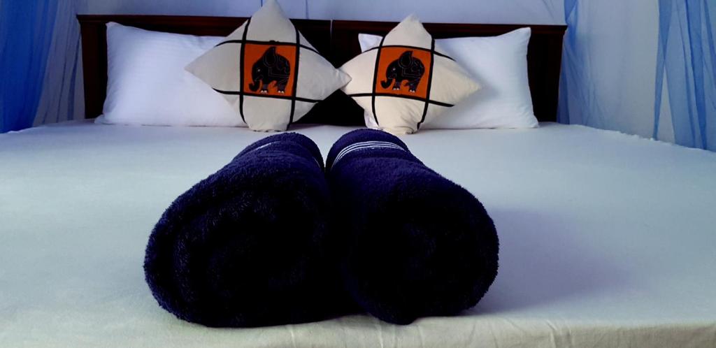Postel nebo postele na pokoji v ubytování Jaye's Homestay