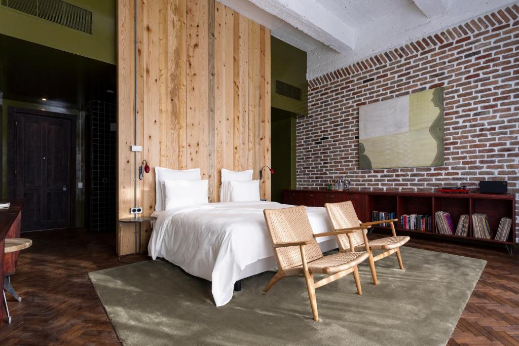 Postel nebo postele na pokoji v ubytování Stamba Hotel