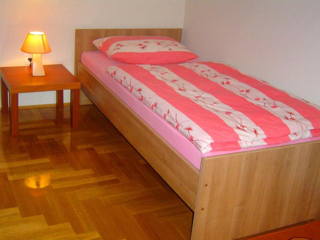 Postel nebo postele na pokoji v ubytování Apartmani Almica