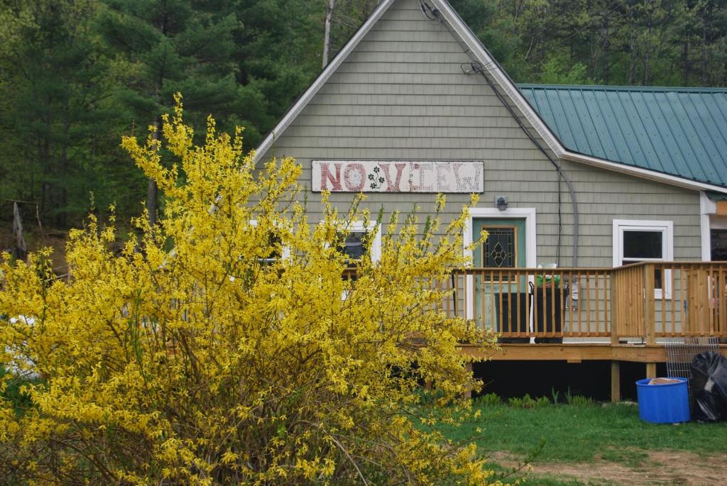 a house with a no smoking sign on it at No View Farm in Rumford