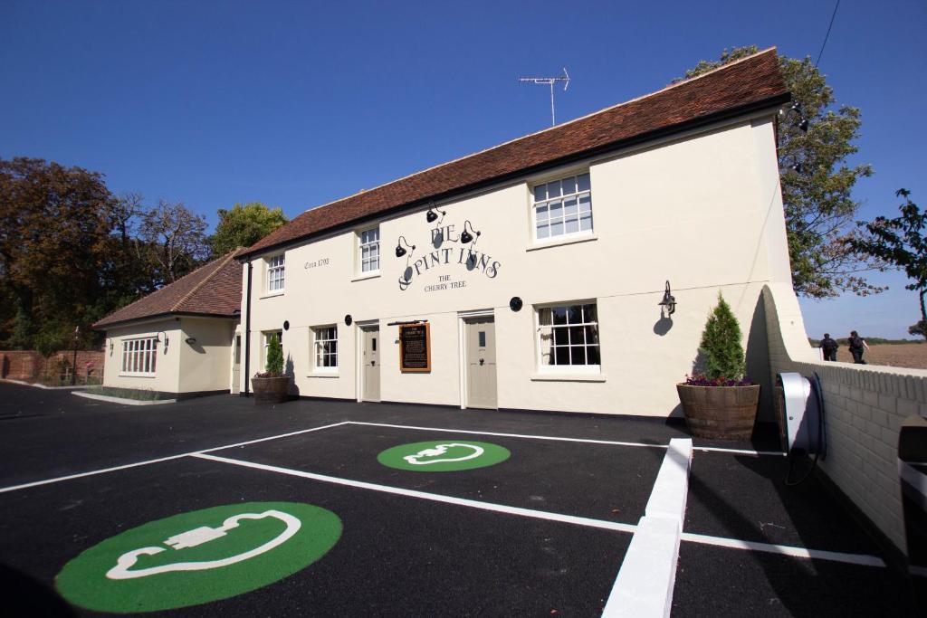 a building with a parking lot in front of it at The Cherry Tree Rochford in Rochford