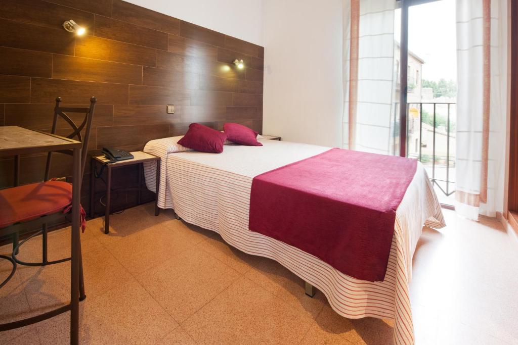 Postel nebo postele na pokoji v ubytování Hostal Sol