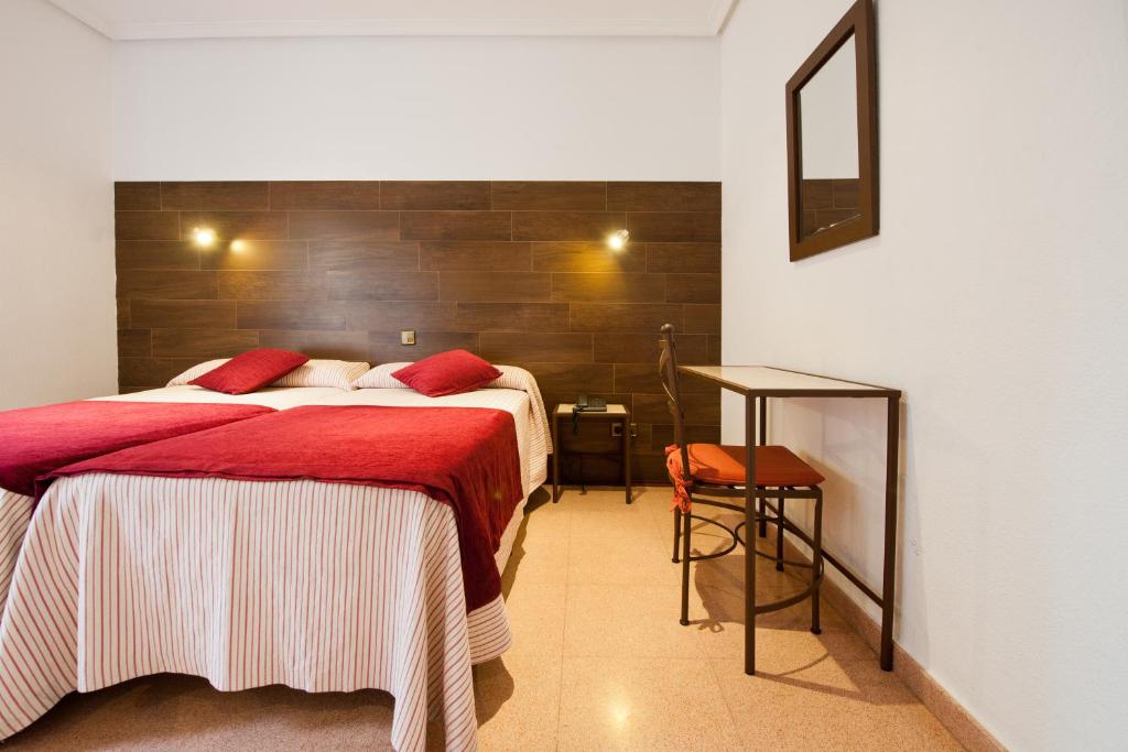 Postel nebo postele na pokoji v ubytování Hostal Sol