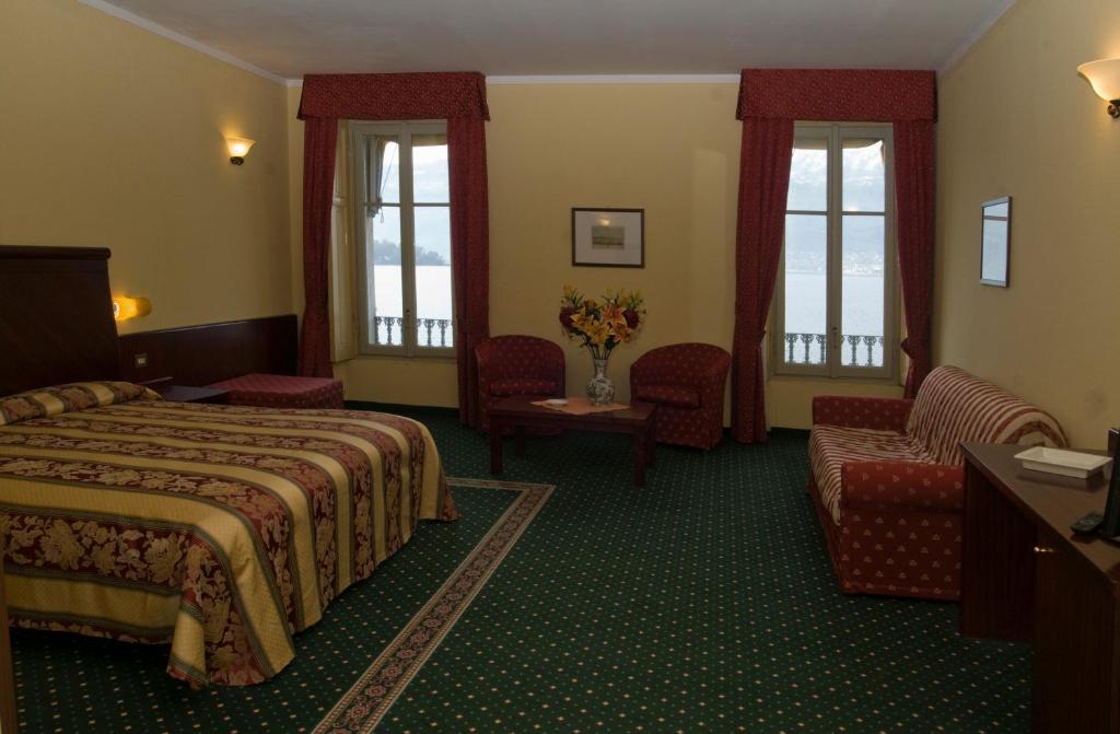 Postel nebo postele na pokoji v ubytování Europalace Hotel