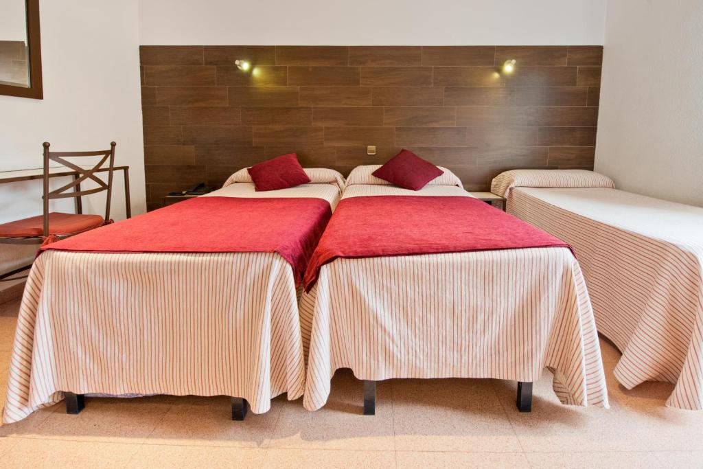Postel nebo postele na pokoji v ubytování Hostal Sol