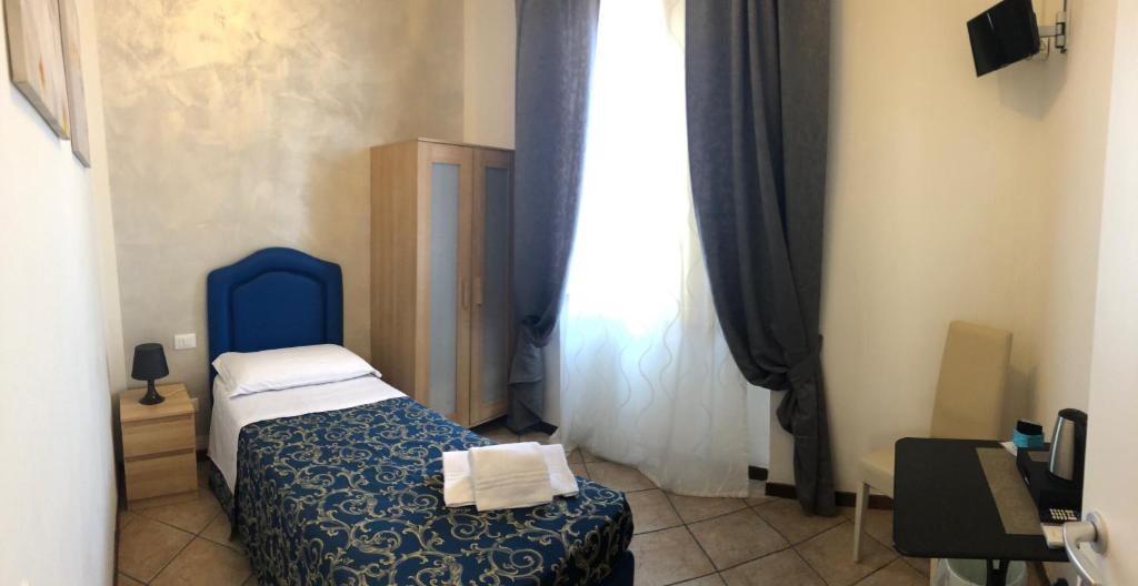 A bed or beds in a room at B&B La Cittadella