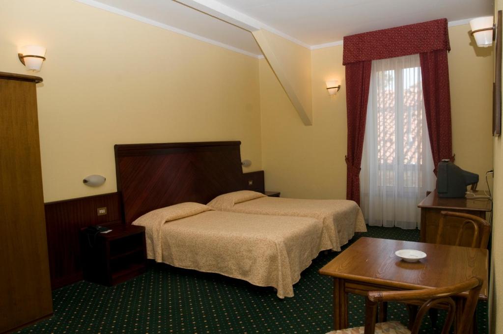 Postel nebo postele na pokoji v ubytování Europalace Hotel