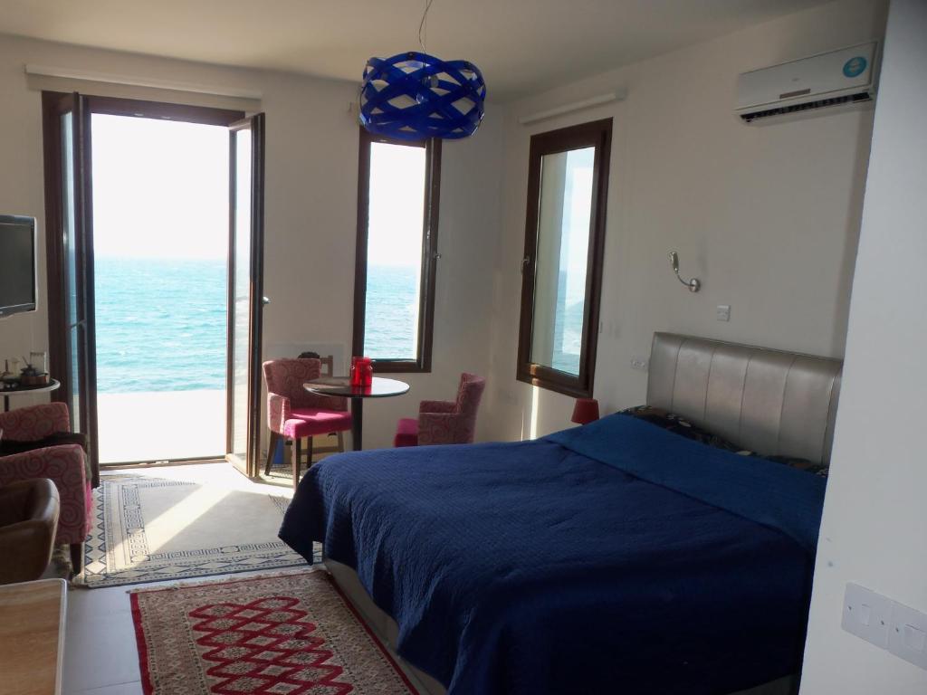 Postel nebo postele na pokoji v ubytování Beach Villa Pantheon