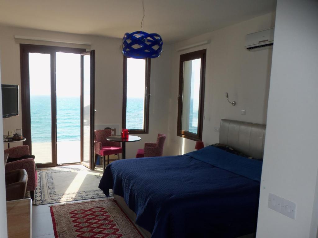 Postel nebo postele na pokoji v ubytování Beach Villa Pantheon