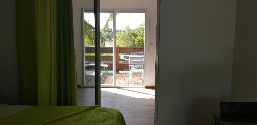 Postel nebo postele na pokoji v ubytování Jardin D'eden