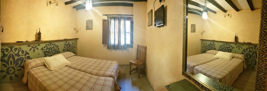 Postel nebo postele na pokoji v ubytování Hotel Rural Calatañazor