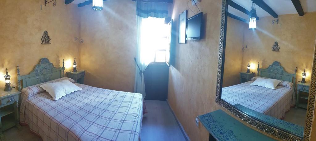 Postel nebo postele na pokoji v ubytování Hotel Rural Calatañazor