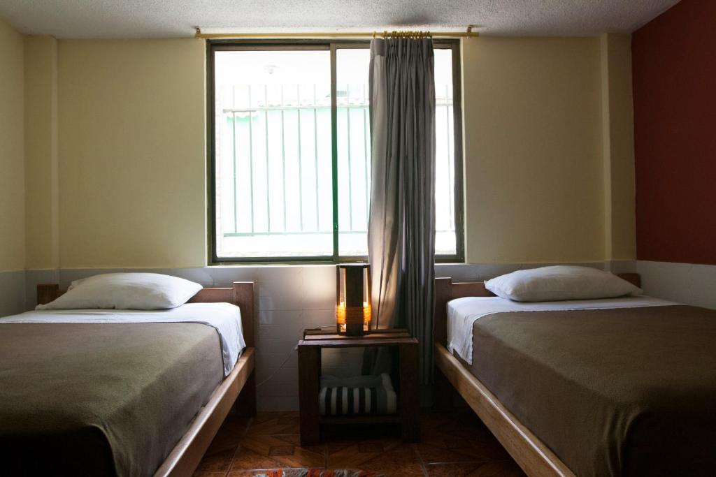 Postel nebo postele na pokoji v ubytování Papachos Hostel