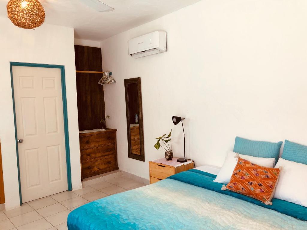Postel nebo postele na pokoji v ubytování Casa Alberto Cozumel