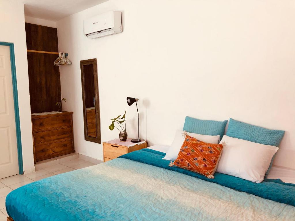Postel nebo postele na pokoji v ubytování Casa Alberto Cozumel