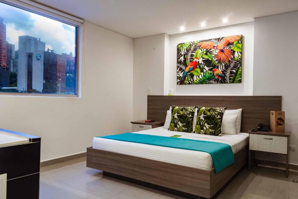 Postel nebo postele na pokoji v ubytování Lleras Green Hotel