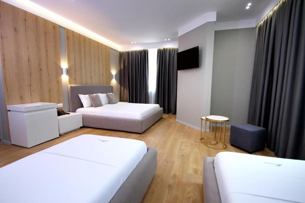 Postel nebo postele na pokoji v ubytování Hotel One