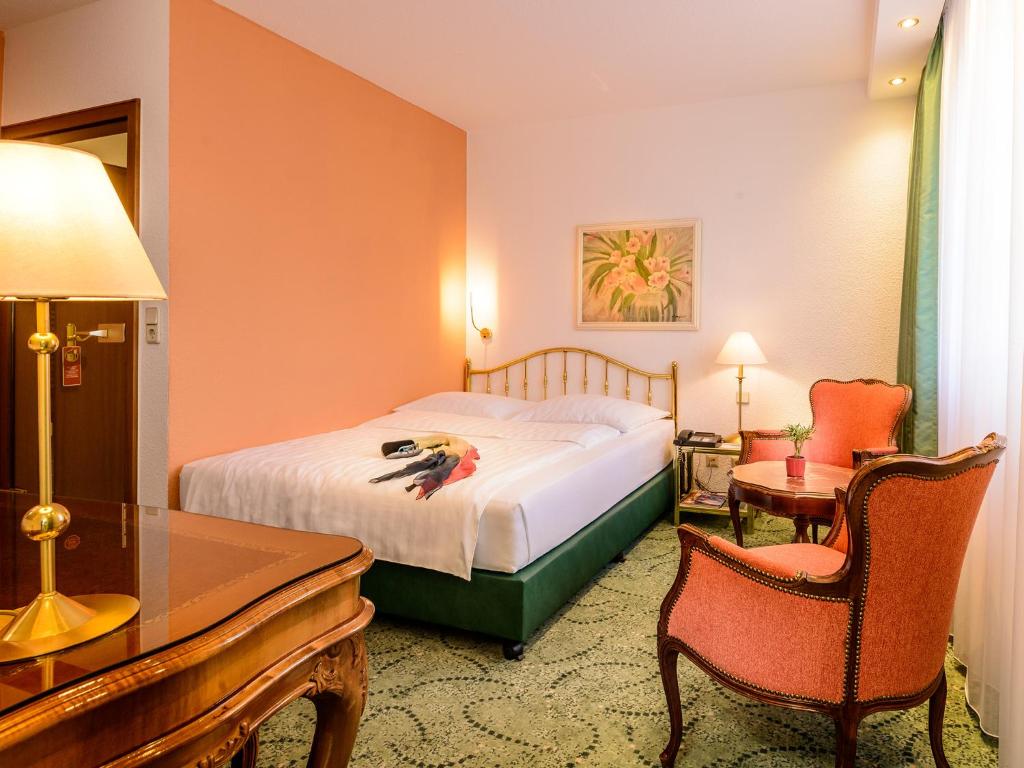 Postel nebo postele na pokoji v ubytování Hotel Palmenhof