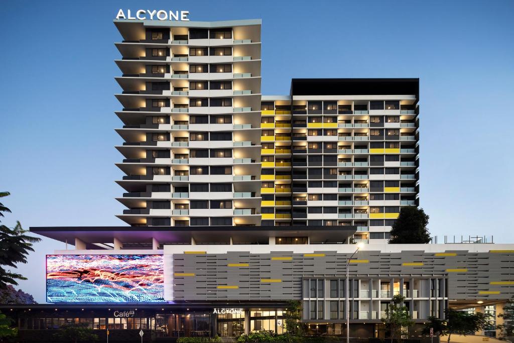 a rendering of a apartment building with a large screen at Alcyone Hotel Residences in Brisbane