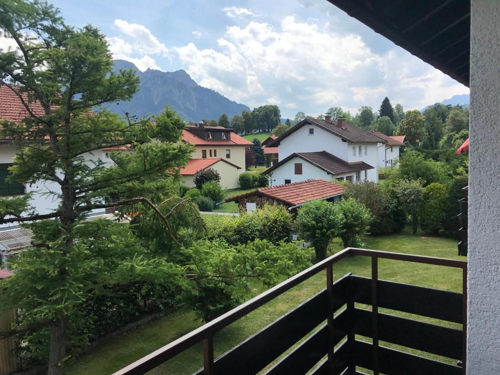 a view of a village from the balcony of a house at Ludwigslust - Ferienappartement mit Bergblick in Schwangau