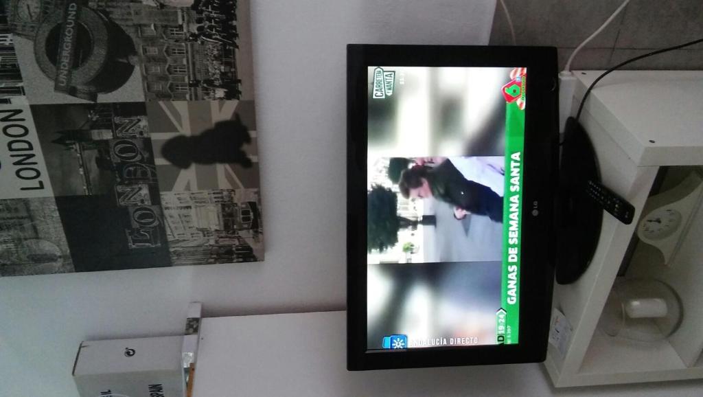 Una televisión o centro de entretenimiento en MINI-APARTAMENT