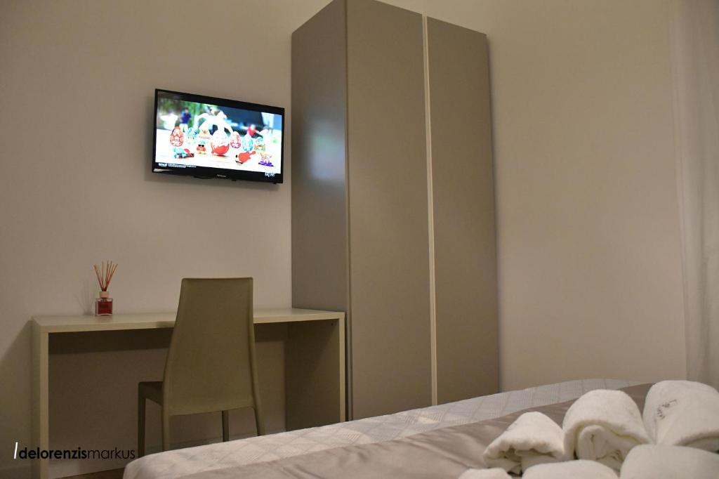TV a/nebo společenská místnost v ubytování Les 3 Chambres