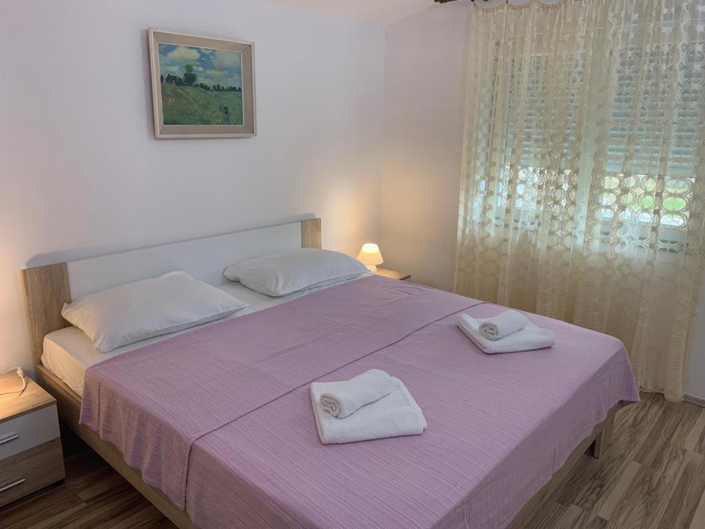 Ένα ή περισσότερα κρεβάτια σε δωμάτιο στο Apartment Jana