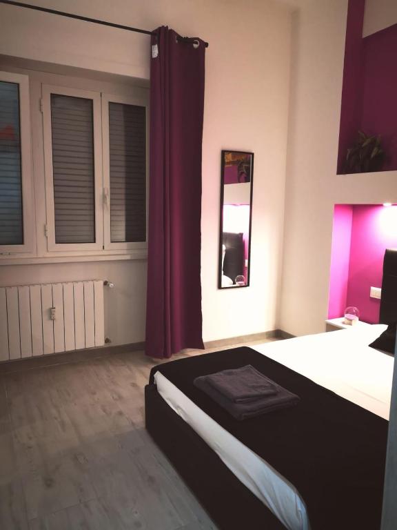 A bed or beds in a room at The Royals
