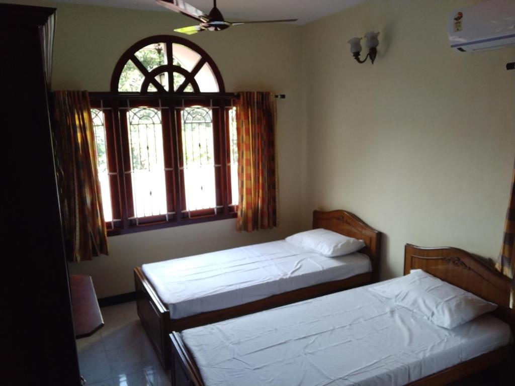 Postel nebo postele na pokoji v ubytování ZuriEL Suite GUEST HOUSE