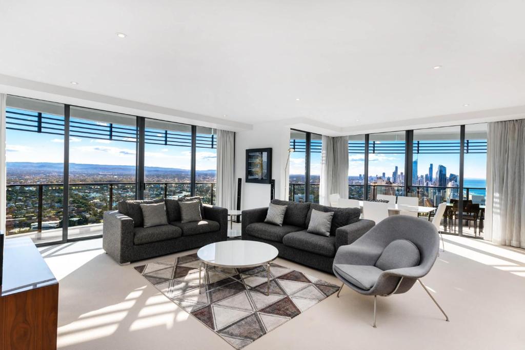 an apartment living room with a view of the city at Peppers Broadbeach in Gold Coast