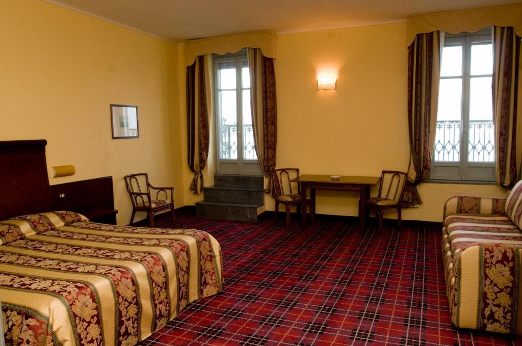 Postel nebo postele na pokoji v ubytování Europalace Hotel