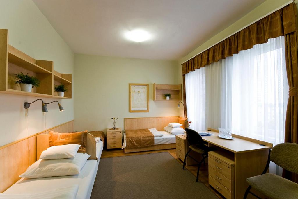 Voodi või voodid majutusasutuse Hotel Kerpely toas