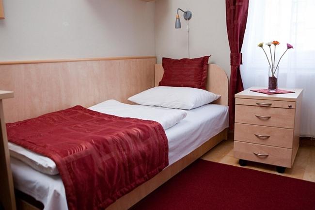Voodi või voodid majutusasutuse Hotel Kerpely toas