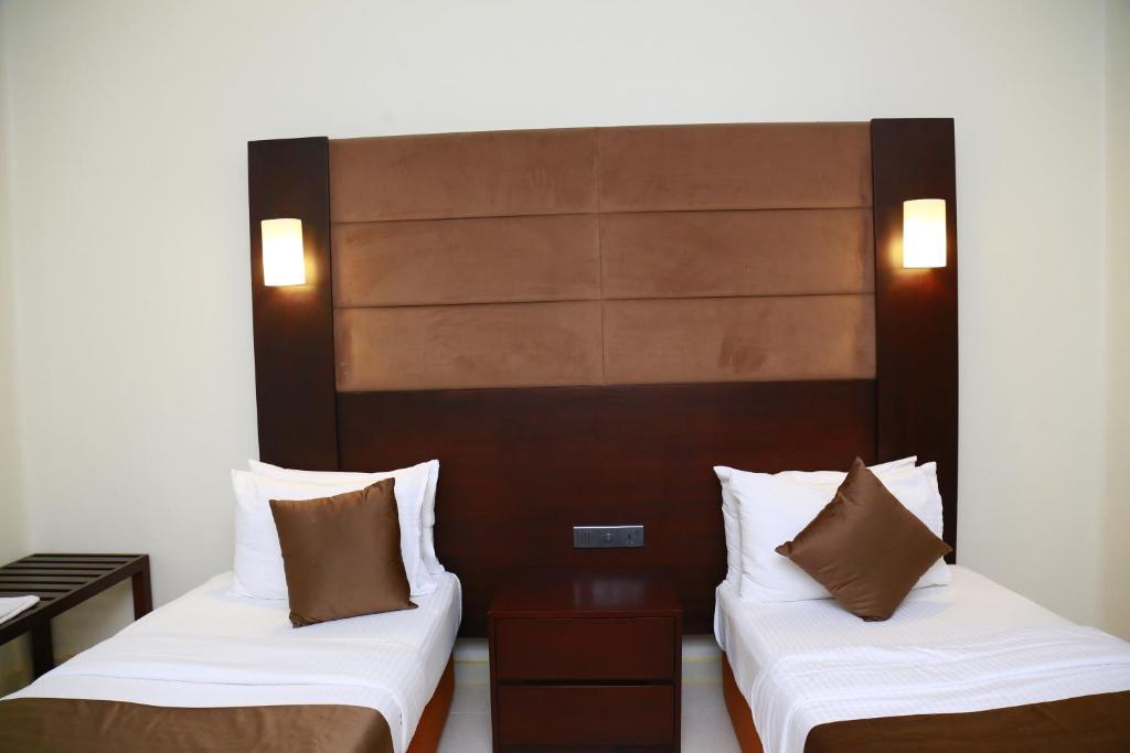 Postel nebo postele na pokoji v ubytování Sea Port