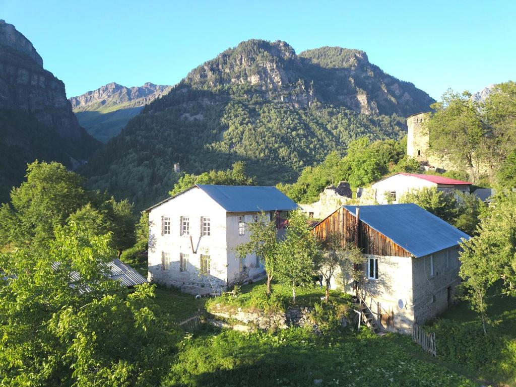 an aerial view of an old house in the mountains at Ciuri's Guesthouse in Zhabeshi