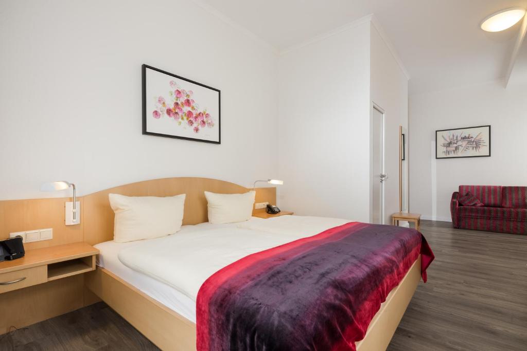 Rúm í herbergi á Hotel Künstlerhaus