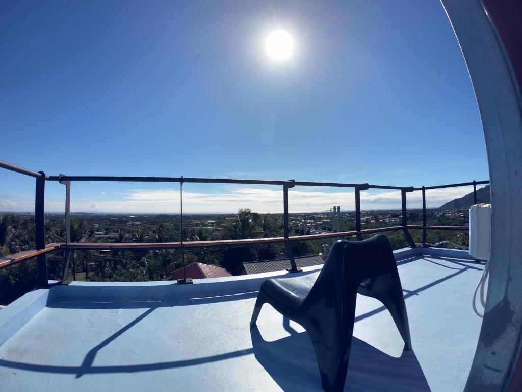 a pair of black high heel shoes sitting on a balcony at Rich Travel in Lijia