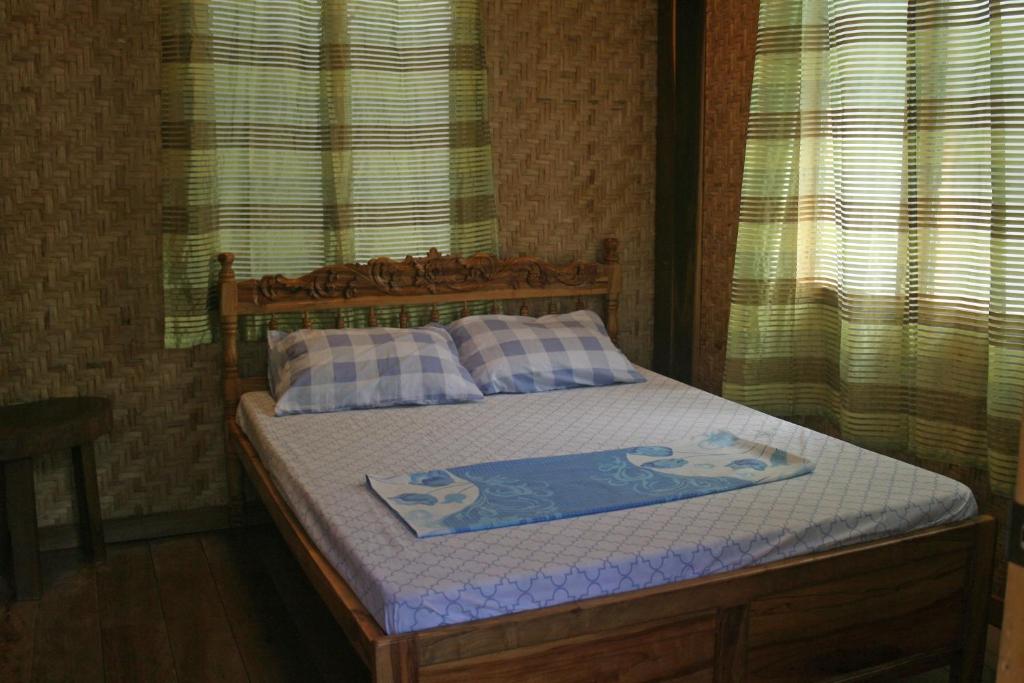 Postel nebo postele na pokoji v ubytování JJS BACKPACKERS VILLAGE