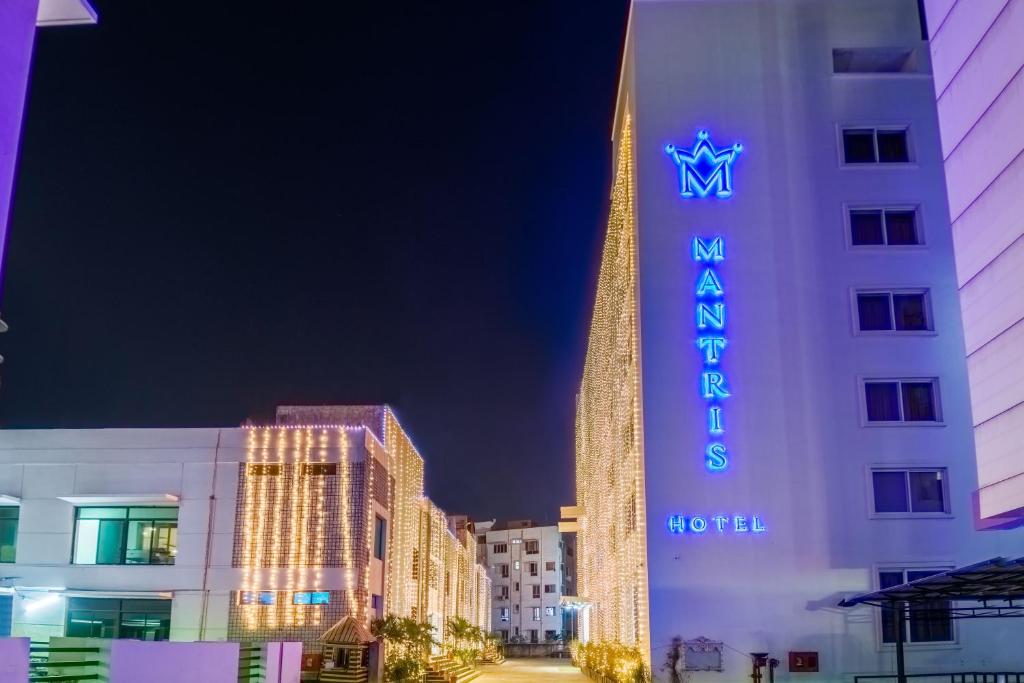 a view of the mgm hotel at night at Mantris Hotel in Visakhapatnam