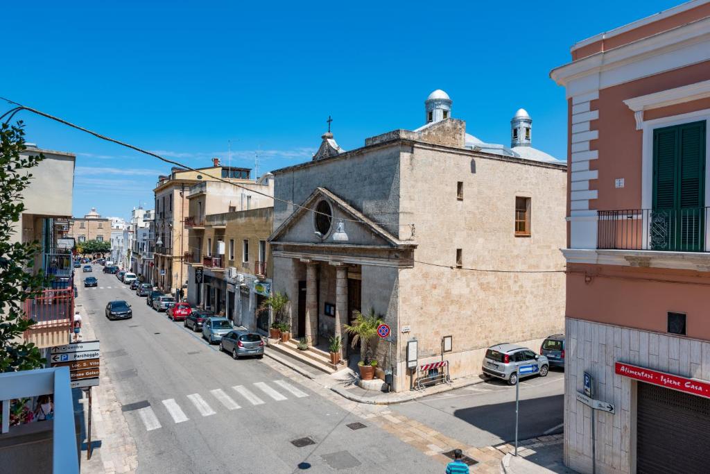 an old building on the side of a street at Sinestesia in Polignano a Mare