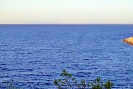 a large body of water with a large body of water at Tramontana in Hydra