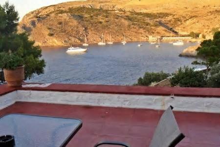 a view of a lake with boats in the water at Tramontana in Hydra