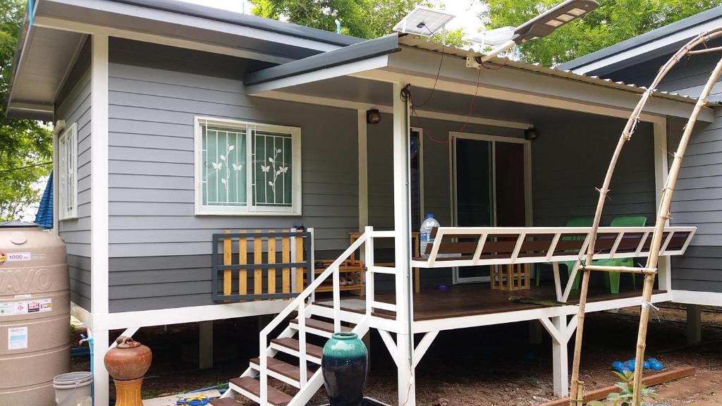 a screened in porch of a tiny house at Tarmtawan garden home in Nakhon Nayok