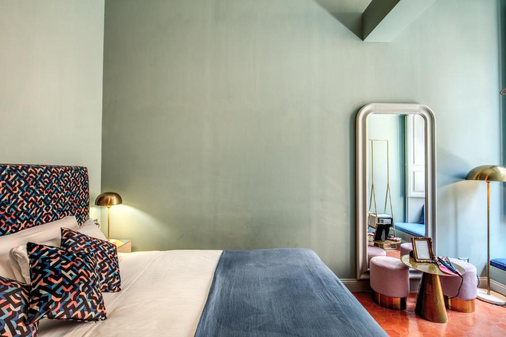 A bed or beds in a room at Glance in Rome