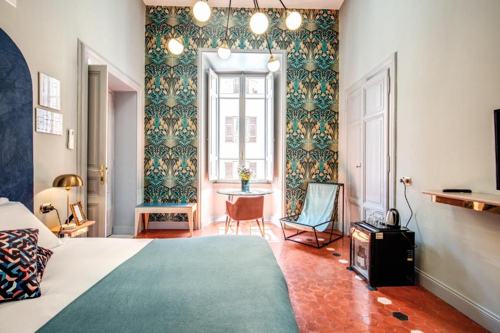 A bed or beds in a room at Glance in Rome