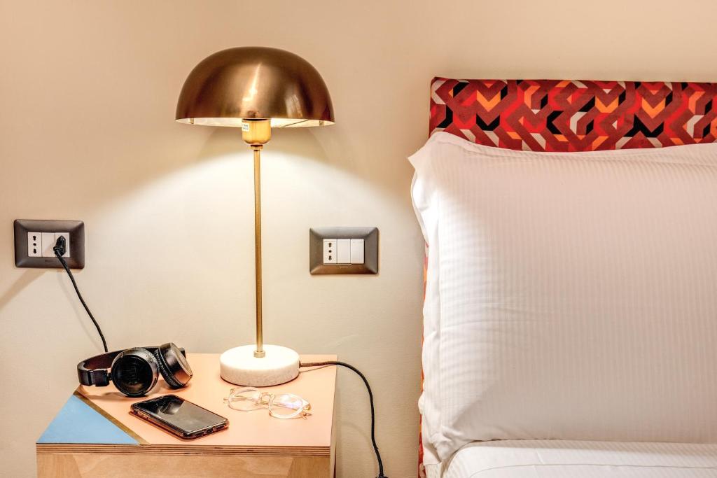 A bed or beds in a room at Glance in Rome