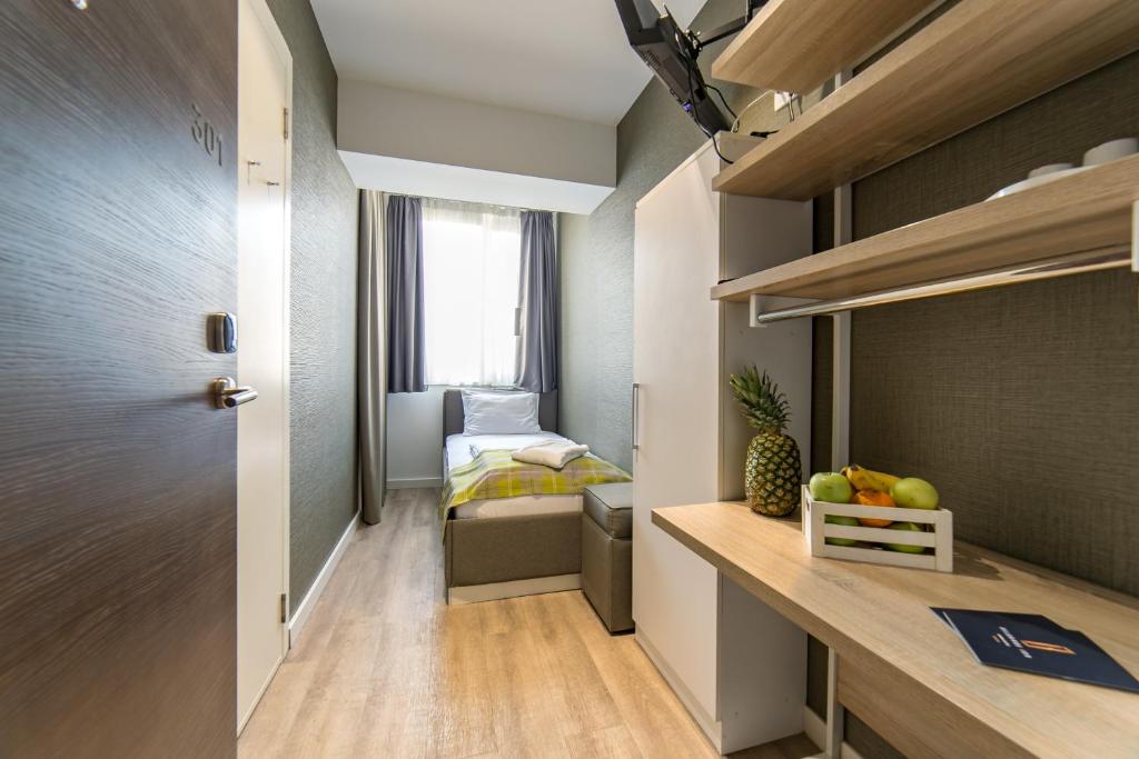Krevet ili kreveti u jedinici u okviru objekta Belgrade Inn Garni Hotel
