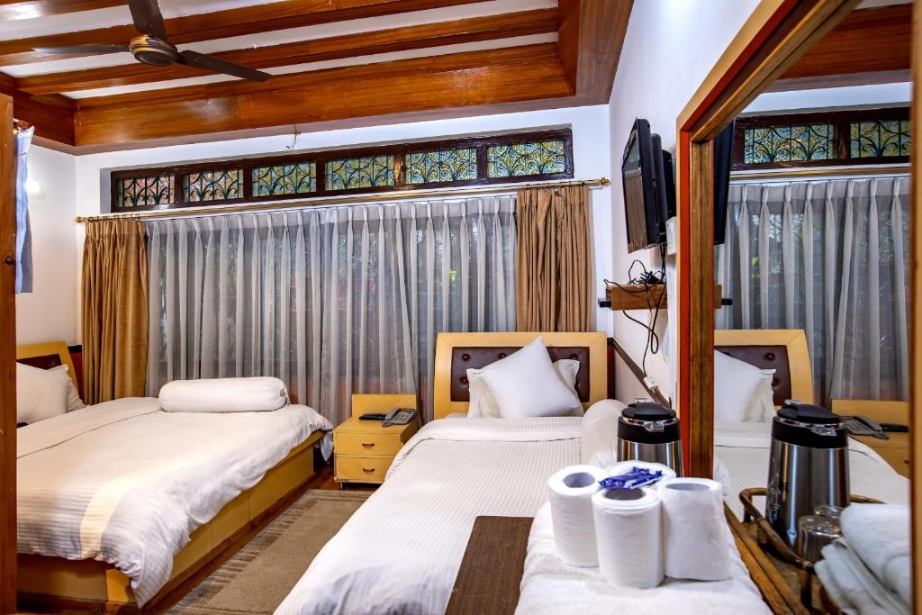 Postel nebo postele na pokoji v ubytování Shangrila Boutique Hotel